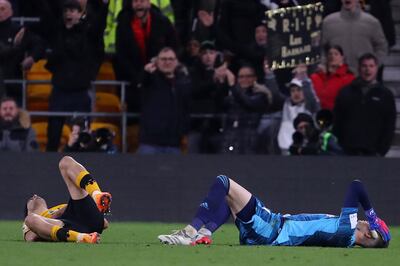 Wolverhampton Wanderers' Mexican striker Raul Jimenez (L) and Leeds United's French goalkeeper Illan Meslier (R) lie injured after a collision that changed course of the match. AFP