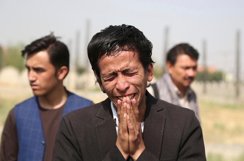Relatives mourn a victim after Wednesday's deadly suicide bombing. AP