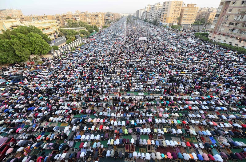 Muslim devotees pray on the first day of Eid Al Fitr in the Heliopolis neighbourhood in Cairo, Egypt. AFP