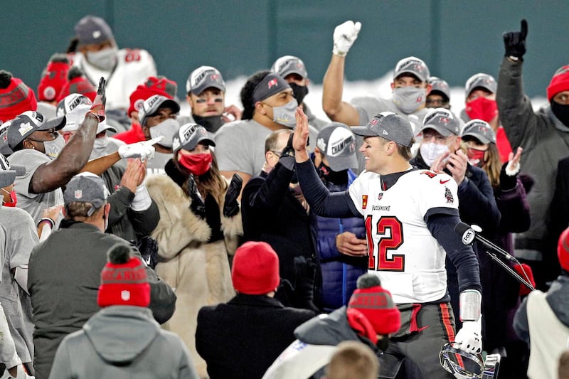 Buccaneers quarterback Tom Brady celebrates with his teammates after beating the Packers at Lambeau Field. USA TODAY Sports