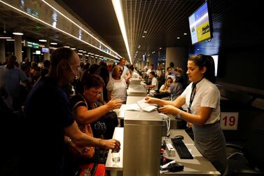 British passengers queue up in a check-in service at Dalaman Airport, Turkey, after Thomas Cook, the world's oldest travel firm, collapsed stranding hundreds of thousands of holidaymakers around the globe. Reuters