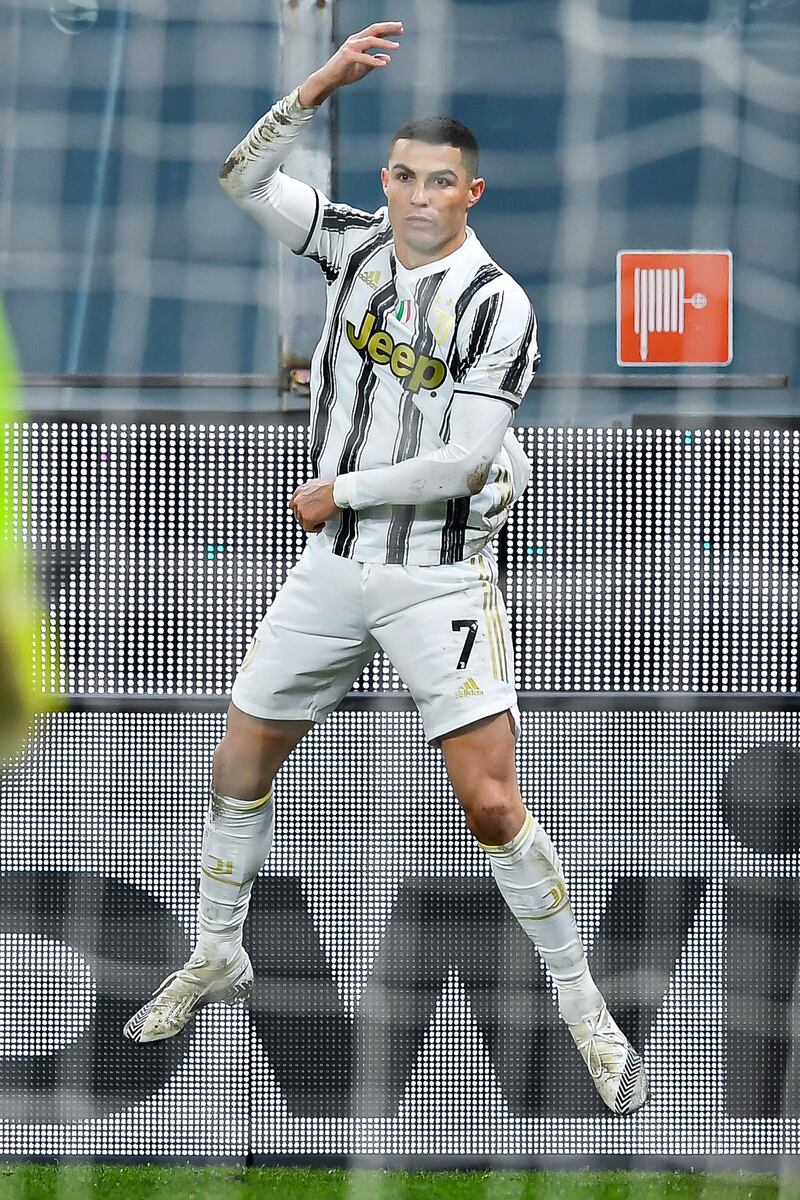 GENOA, ITALY - DECEMBER 13: Cristiano Ronaldo of Juventus celebrates after scoring his second goal on his second penalty kick during the Serie A match between Genoa CFC and Juventus Fc at Stadio Luigi Ferraris on December 13, 2020 in Genoa, Italy. (Photo by Paolo Rattini/Getty Images)