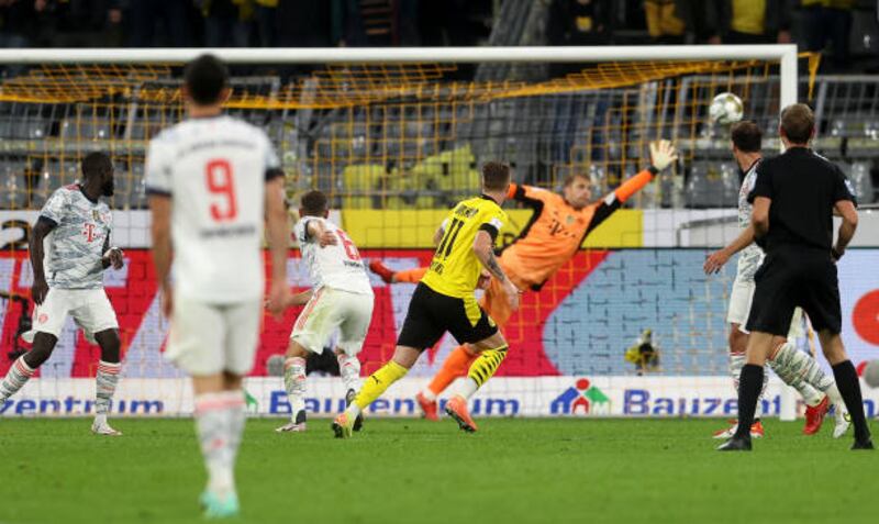 Marco Reus scores for Borussia Dortmund.