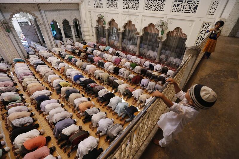 Indian Muslims offer prayers on the first Friday of Ramadan at a mosque in Allahabad, India. Rajesh Kumar Singh / AP Photo