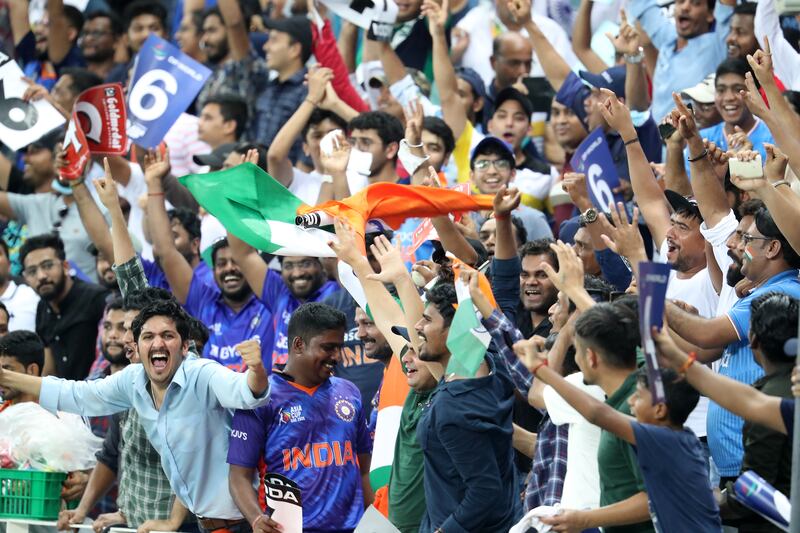 Fans during the game at the Dubai International Cricket Stadium.