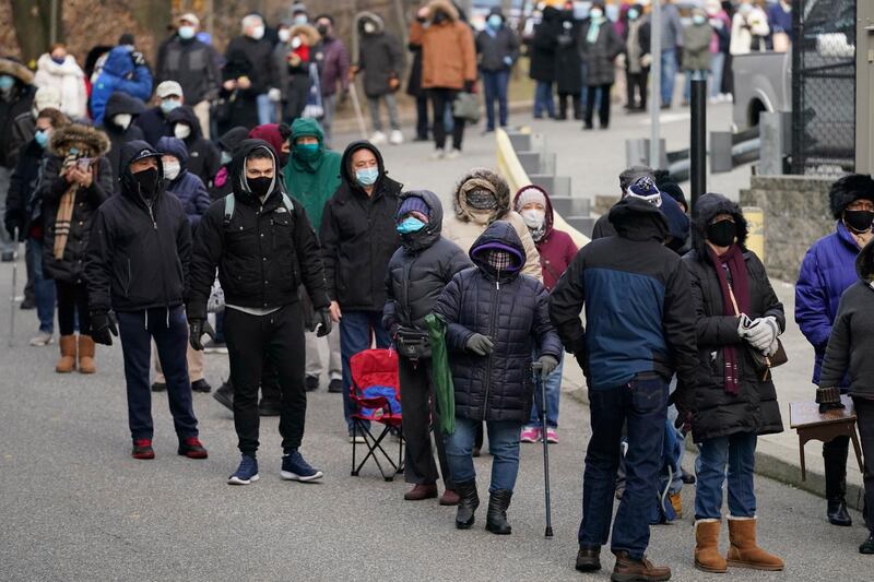 People wait in line for the Covid-19 vaccine in Paterson, New Jersey. AP Photo