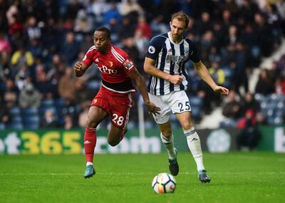 Soccer Football - Premier League - West Bromwich Albion vs Watford - The Hawthorns, West Bromwich, Britain - September 30, 2017   West Bromwich Albion's Craig Dawson in action with Watford's Andre Carrillo    REUTERS/Rebecca Naden  EDITORIAL USE ONLY. No use with unauthorized audio, video, data, fixture lists, club/league logos or "live" services. Online in-match use limited to 75 images, no video emulation. No use in betting, games or single club/league/player publications. Please contact your account representative for further details.