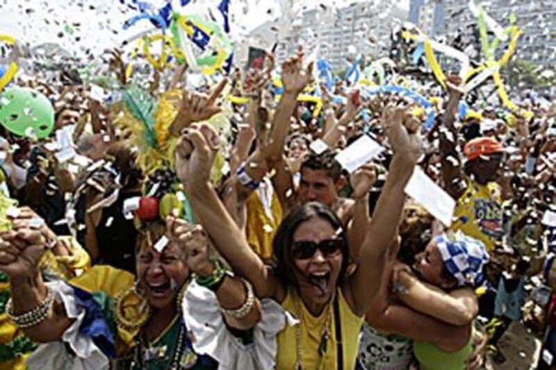 Residents celebrate on Copacabana beach after Rio de Janeiro won the bid to host the 2016 Olympic Games.