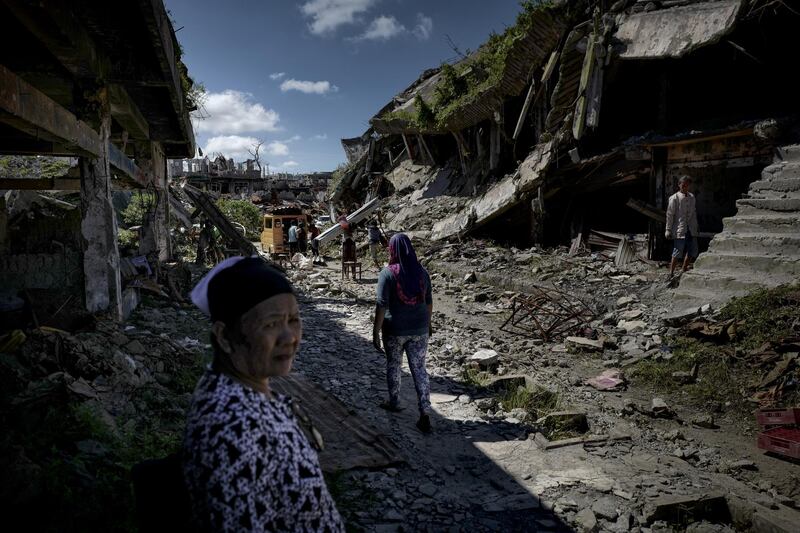 Residents salvage any usable items they can find from what is left of their homes as they were allowed to enter for three days in what used to be the main battle area during the siege of Marawi, on May 10, 2018. All photos by Jes Aznar / Getty Images