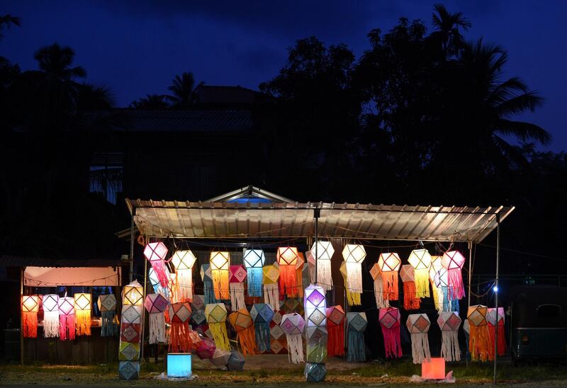 A Sri Lankan street vendor sells lanterns ahead of the 'Vesak' festival in Colombo. AFP