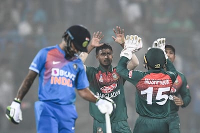 Bangladesh's Aminul Islam (C) celebrates with teammates after dismissing India's Shreyas Iyer (not pictured) during the first T20 international cricket match of a three-match series between Bangladesh and India, at Arun Jaitley Cricket Stadium in New Delhi on November 3, 2019. ----IMAGE RESTRICTED TO EDITORIAL USE - STRICTLY NO COMMERCIAL USE-----
 / AFP / Jewel SAMAD / ----IMAGE RESTRICTED TO EDITORIAL USE - STRICTLY NO COMMERCIAL USE-----
