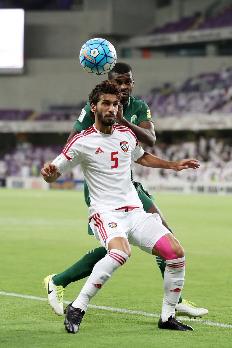 Al Ain, United Arab Emirates - August 29th, 2017: UAE's Tariq Ahmed and Saudi's Mansour Al Harbi during the World Cup qualifying game between UAE v Saudi Arabia. Tuesday, August 29th, 2017 at Hazza Bin Zayed Stadium, Al Ain. Chris Whiteoak / The National