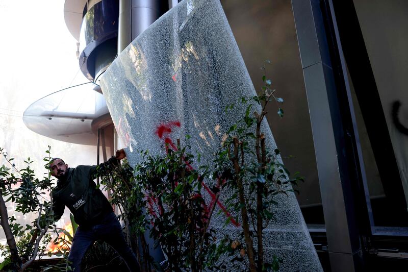 Branch windows were also vandalised and smashed. AFP