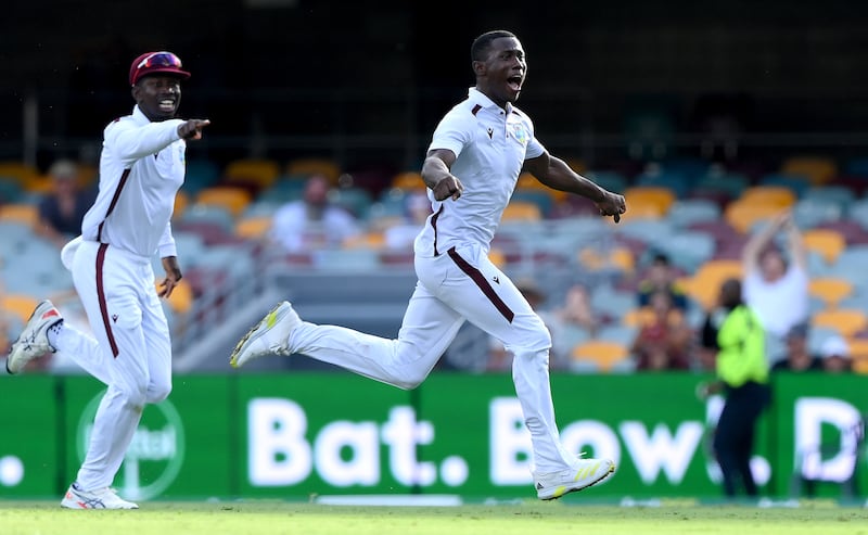 Shamar Joseph celebrates victory after taking the wicket of Josh Hazlewood at the Gabba on Sunday. Getty Images