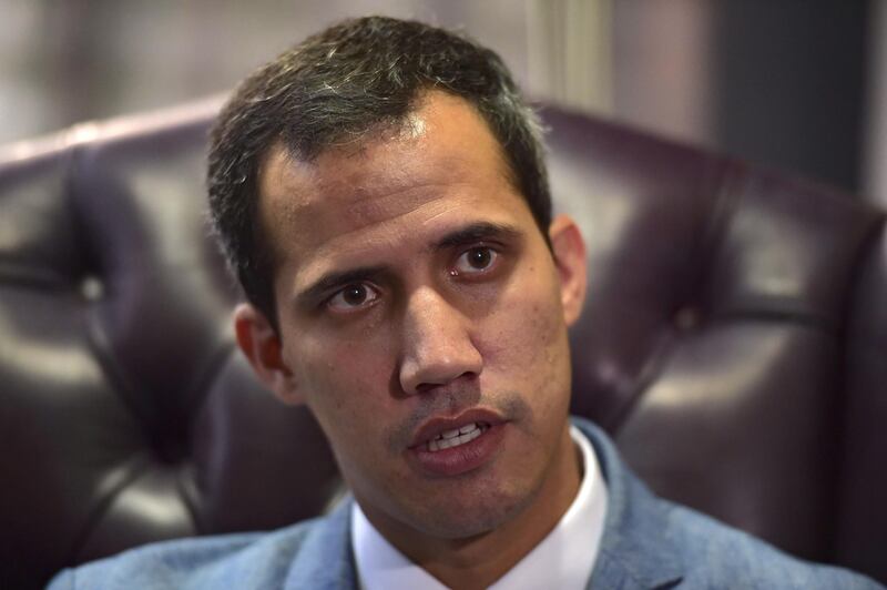The president of Venezuela's National Assembly and self-proclaimed acting president Juan Guaido speaks during an exclusive interview with AFP in Caracas on February 8, 2019.  Venezuela's self-proclaimed acting leader Juan Guaido refused to rule out Friday the possibility of authorizing a US intervention to help force President Nicolas Maduro from power and alleviate a humanitarian crisis.
 / AFP / YURI CORTEZ
