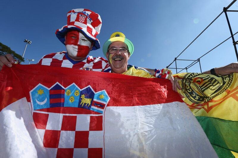 A fan of Croatia, left, and Brazil, right, pose together before Thursday's opening match to the 2014 World Cup in Sao Paulo, Brazil. Warren Little / Getty Images