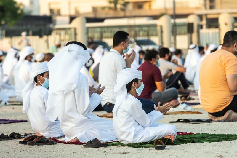 Eid prayers, also known as Salat al-Eid and Șālat al-'Īdayn, is the special prayers (salah) offered to celebrate the Islamic festival at the end of the Holy Month of Ramadan. Traditionally it is held in an open space, Eidgah, such as an allocated spcae or field specifically available for prayer. The UAE Authorities allowed communal Eid prayers again this year with a strict policy of social distancing anf a 15 minite prayer access throughout the UAE after last years locdown due to the Covid - 19 pandemic. Worshippers attend the Eid Prayer at the Umm Suquim Eid prayer grounds on May 13 th, 2021. 
Antonie Robertson / The National.
Reporter: None for National.