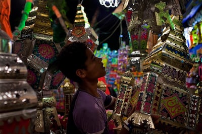 An Egyptian teenager arranges Ramadan Fanous (lanterns) for sale in the Sayyeda Zeinab neighborhood of Cairo, Egypt August 13, 2010. The colorful lanterns are sold during the holy month of Ramadan and are a particularly Egyptian tradition. This year however, lanterns displays have burned less bright after the Egyptian government appealed to the public to reduce its' electric power usage in order to avoid blackouts and power outages.  (Photo by Scott Nelson, for the National)