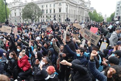 Protesters gather in Parliament Square during the Black Lives Matter protest rally in Whitehall, London, in memory of George Floyd who was killed on May 25 while in police custody in the US city of Minneapolis. (Gareth Fuller/PA via AP)