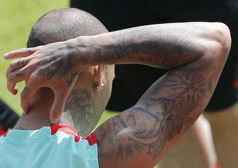 Tatoos are pictured on the arm of Portugal’s player Ricardo Quaresma during training.  REUTERS/Regis Duvignau