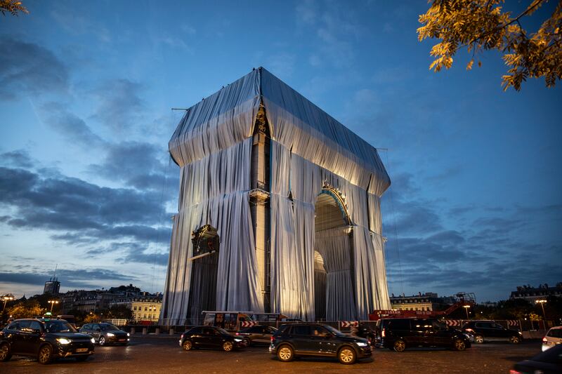 The process of wrapping up the Arc De Triomphe monument in silver-blue fabric has begun in Paris, France. Getty Images