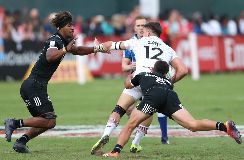 England's Harry Glover in action with Masirewa and Andrew Scott Knewstubb. Reuters