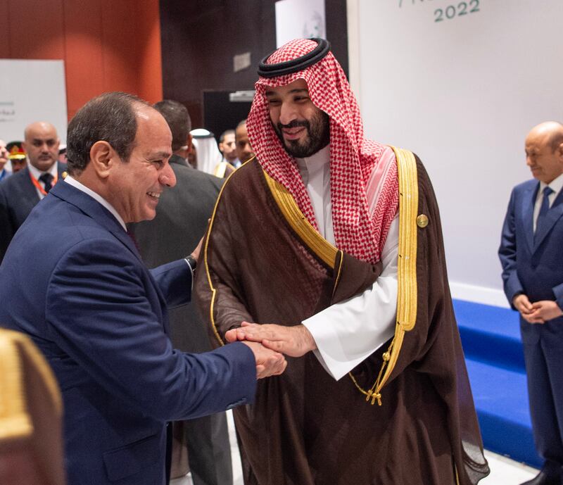 Saudi Crown Prince Mohammed bin Salman and Egyptian President Abdel Fattah El Sisi shake hands during the Middle East Green Initiative conference, held on the sidelines of the the UN's Cop27 climate summit in Sharm El Sheikh, Egypt. EPA