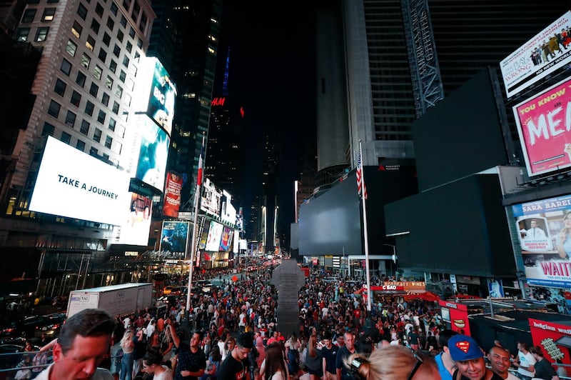 Screens in Times Square are black during a power outage in New York.  AP