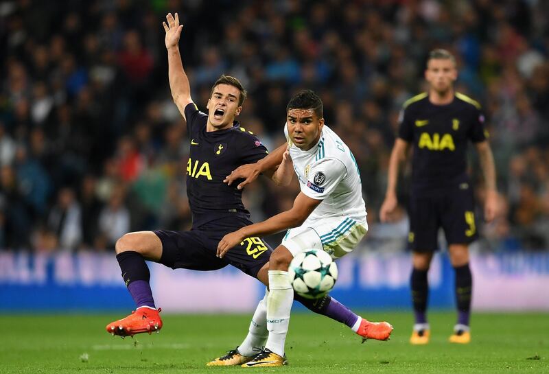 MADRID, SPAIN - OCTOBER 17: Harry Winks of Tottenham Hotspur is fouled by Casemiro of Real Madrid during the UEFA Champions League group H match between Real Madrid and Tottenham Hotspur at Estadio Santiago Bernabeu on October 17, 2017 in Madrid, Spain.  (Photo by Laurence Griffiths/Getty Images)