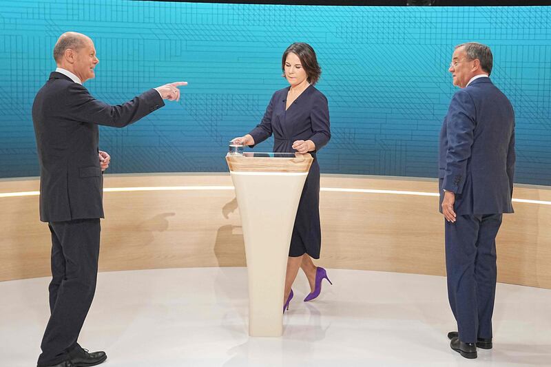 Olaf Scholz (left), Green leader Annalena Baerbock and Armin Laschet, the Christian Democratic Union (CDU) candidate for Chancellor prepare to go head to head in an election TV debate in Berlin . AFP