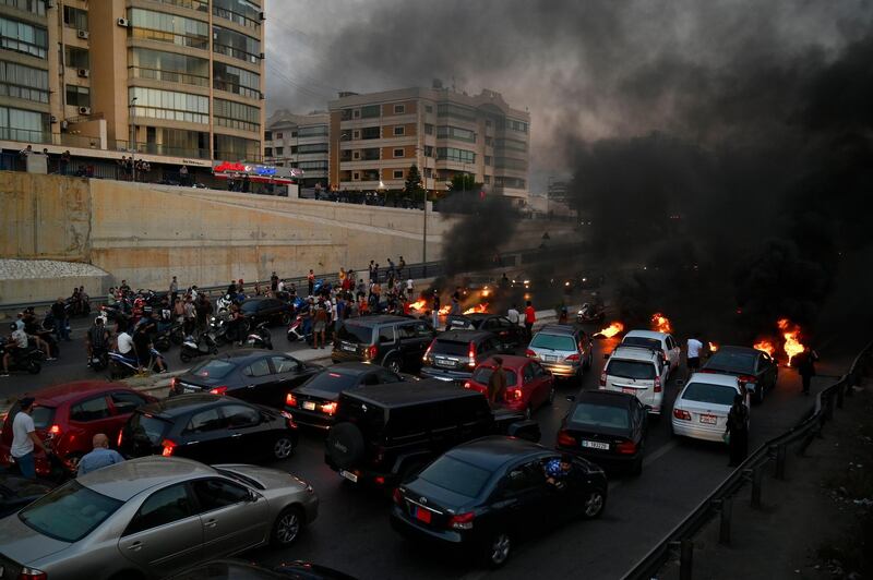 Burning tyres block the road to Rafik Hariri International Airport during anti-government protests in Lebanon. EPA