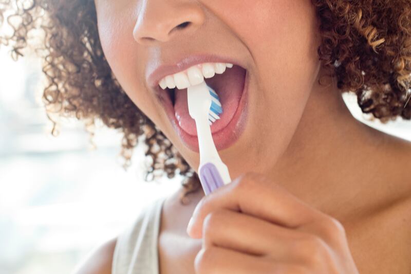 Use a toothbrush with soft bristles to clean your tongue to help avoid bad breath. Photo: Science Photo Library