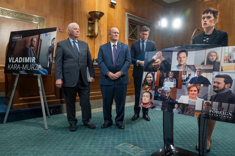 From left, senator Ben Cardin, senator Chris Coons and James Roscoe, deputy head of mission at the British embassy in Washington, listen as Evgenia Kara-Murza, rights advocate and wife of Vladimir Kara-Murza, speaks about her husband. AP