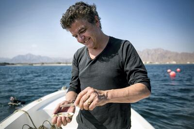 Sean Connolly, chef and owner of a new eponymous restaurant at Dubai Opera, shucks an oyster from Dibba Bay, a new oyster farm in Fujairah. Photo credit: Jordan Bickerstaffe/Liquorice Productions
