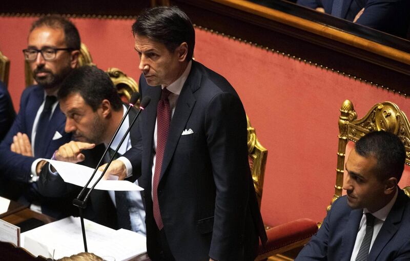 epa07782298 Italian Prime Minister Giuseppe Conte (2-R) is flanked by Deputy Prime Ministers Matteo Salvini (2-L) and Welfare Minister Luigi Di Maio (R) and Justiice Minister, Alfonso Bonafedeas (L) as he addresses the Senate in Rome, Italy, 20 August 2019. Conte in his address to the senate called bringing about the government crisis  irresponsible. Deputy Premier and Interior Minister Matteo Salvini and his party League pulled out from government and caused a political crisis a week ago. Conte said that the government has come to an end and that he would resign.  EPA/CLAUDIO PERI