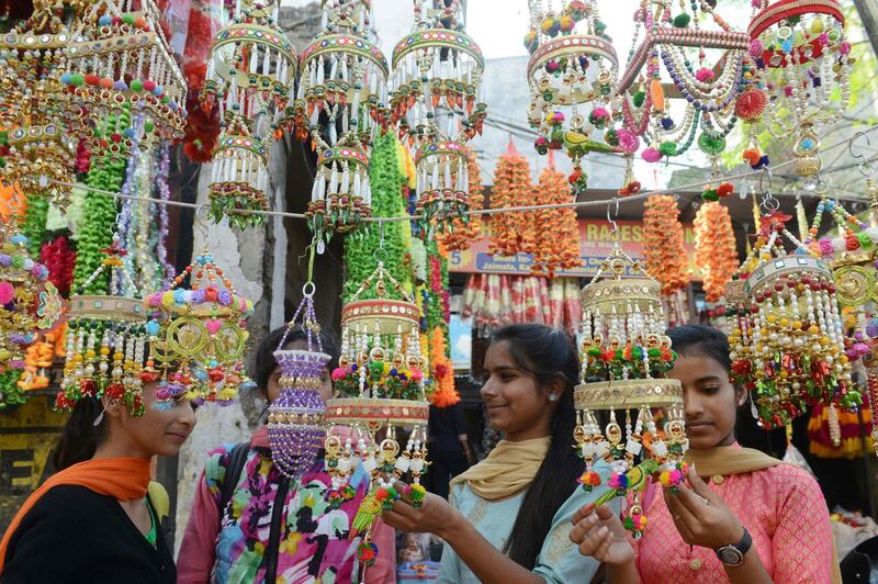 Indian shoppers look for decoration items on the eve of the Hindu festival of Diwali, in Amritsar.  AFP