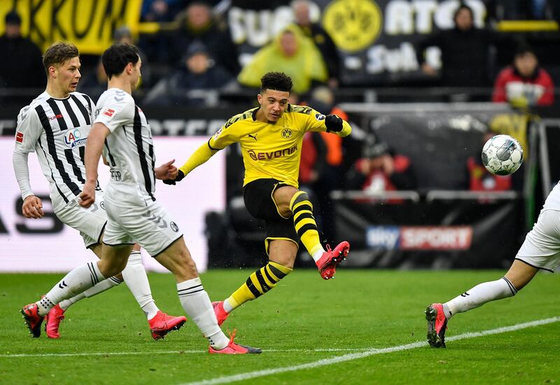 Jadon Sancho shoots on goal against Freiburg. AP