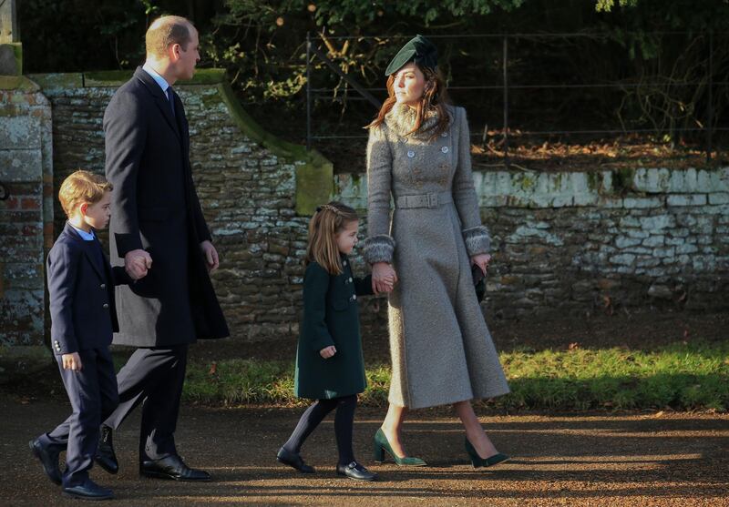 Britain's Prince William, Duke of Cambridge and Catherine, Duchess of Cambridge walk with their children Prince George and Princess Charlotte outside the St Mary Magdalene Church in Sandringham. AP