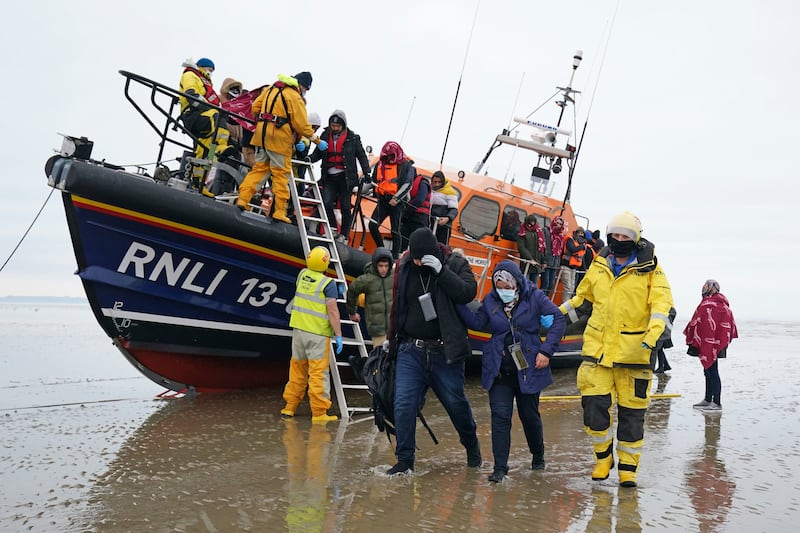 Migrants are brought in to Dungeness, Kent, by the RNLI. AP Photo