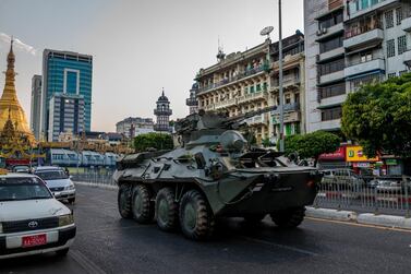 YANGON, MYANMAR - FEBRUARY 14: A military armored vehicle is seen driving along with traffic on a road on February 14, 2021 in Yangon, Myanmar. The U.S. Embassy in Myanmar told Americans in Myanmar to "shelter in place" in an announcement after military movements and reports of possible interruptions to telecoms. Armored vehicles were seen on the streets of Myanmar's capital, and telecoms companies said they had been ordered to suspend services between 1 AM and 9 AM on Monday. (Photo by Hkun Lat/Getty Images)