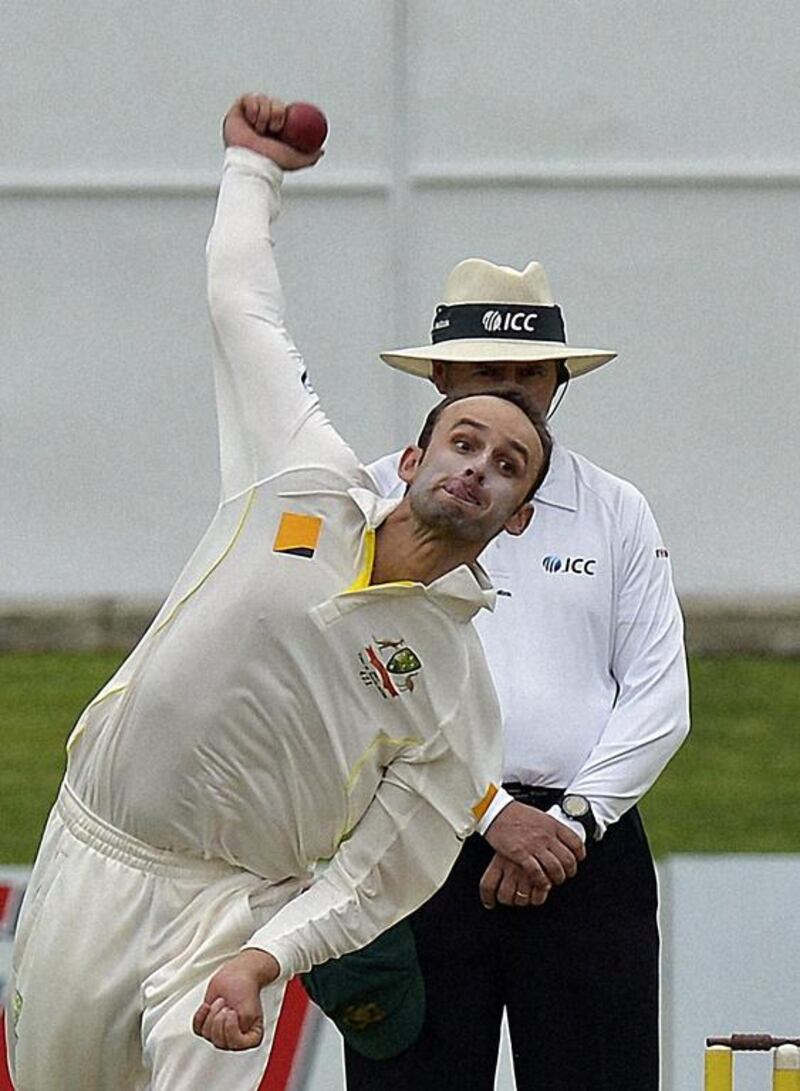 Australian bowler Nathan Lyon took two wickets during the first day of the second Test against South Africa on February 20, 2014. Alexander Joe / AFP
