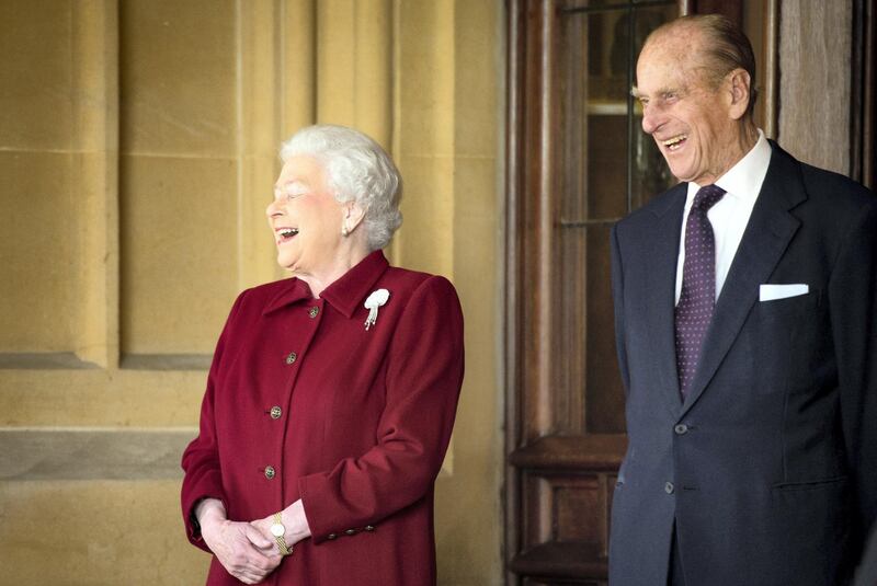 WINDSOR, ENGLAND - APRIL 11:  Britain's Queen Elizabeth II and Prince Philip, Duke of Edinburgh react as they bid farewell to Irish President Michael D. Higgins and his wife Sabina (not pictured) at the end of their official visit at Windsor Castle on April 11, 2014 in Windsor, United Kingdom. Ireland's Michael D. Higgins is making the first state visit by a president of the republic since it gained independence from neighbouring Britain. The visit comes three years after Queen Elizabeth II made a groundbreaking trip to the republic, which helped to heal deep-rooted unease and put British-Irish relations on a new footing.  (Photo by Leon Neal-WPA Pool/Getty Images)