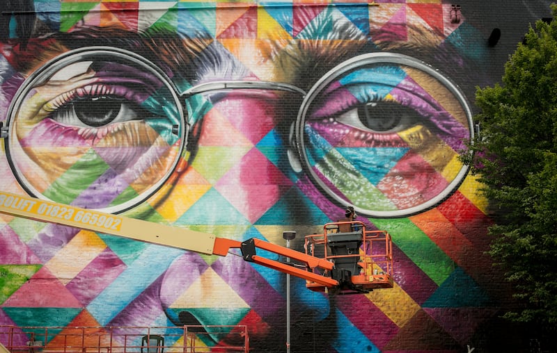 The finishing touches being made to a portrait of John Lennon by the Brazilian artist Eduardo Kobra on the final day of 'Upfest', Europe's largest street art festival in 2017 in Bristol