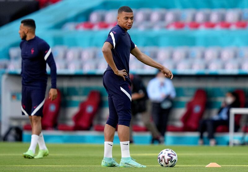 France's Kylian Mbappe speaks during a team training session at Allianz Arena stadium in Munich, Monday, June 14, 2021 the day before the Euro 2020 soccer championship group F match between France and Germany. (AP Photo/Matthias Schrader)