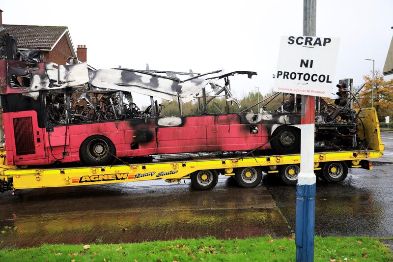 A burnt double decker bus in North Belfast, Northern Ireland, Nov 8. The bus was hijacked and set on fire in a loyalist area by four men. AP