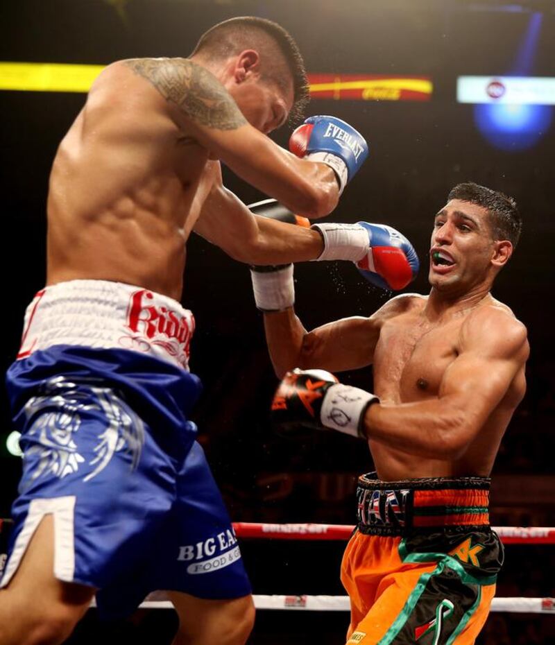 British boxer Amir Khan, right, won a social-media poll to determine Floyd Maywether Jr’s next opponent, but no deal is set. Scott Heavey / Getty Images

