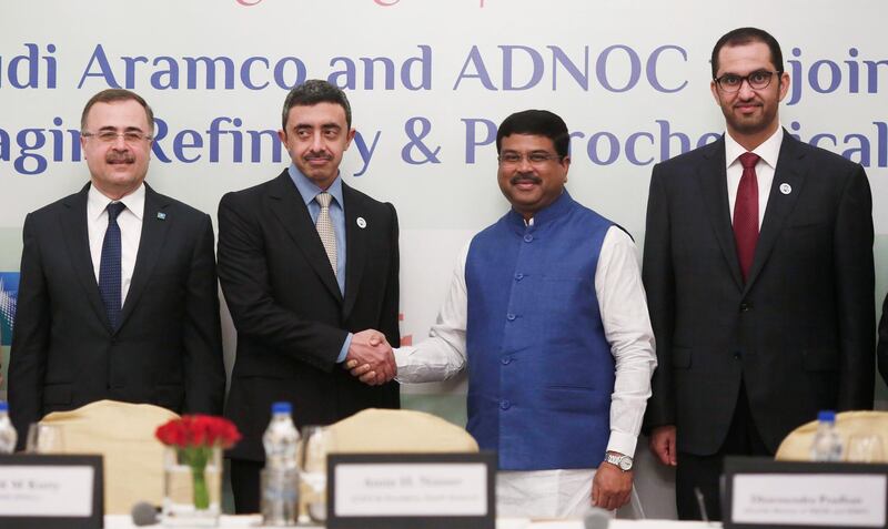 India's Oil Minister Dharmendra Pradhan shakes hands with UAE's Foreign Minister Sheikh Abdullah bin Zayed Al Nahyan after a signing of Memorandum of Understanding (MOU) between Saudi Aramco Chief Executive Officer Amin Nasser and ADNOC CEO Ahmed al Jaber, also a minister of state of the UAE government, during an event in New Delhi, India, June 25, 2018. REUTERS/Adnan Abidi