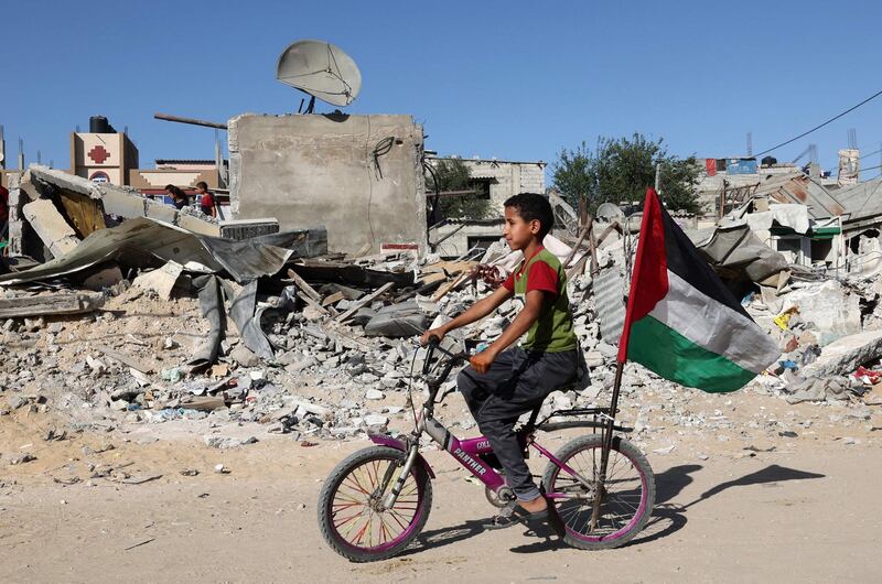 Life goes on among the ruins of buildings destroyed during recent Israeli bombing in Rafah, in the southern Gaza Strip. AFP