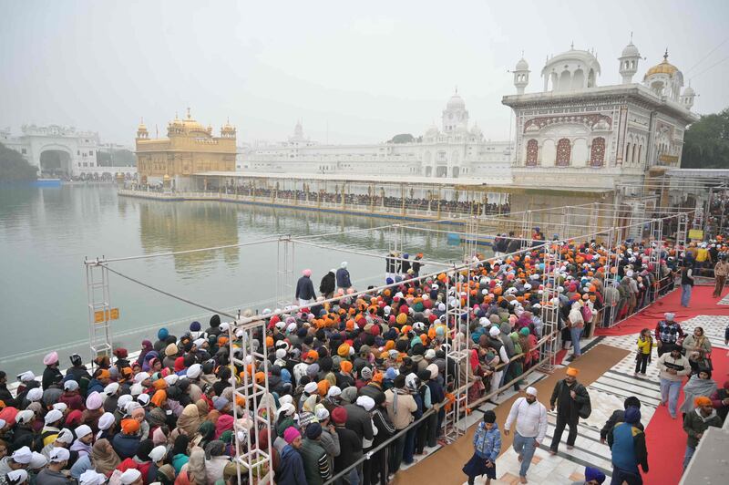 Devotees gather to pay their respects at the Golden Temple on the New Year's Day in Amritsar. AFP