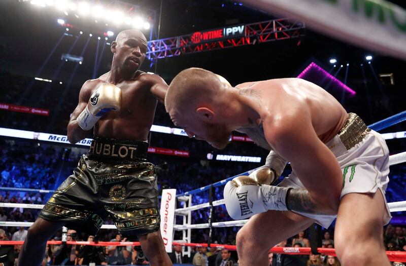 Boxing - Floyd Mayweather Jr. vs Conor McGregor - Las Vegas, USA - August 26, 2017  Floyd Mayweather Jr. in action with Conor McGregor REUTERS/Steve Marcus